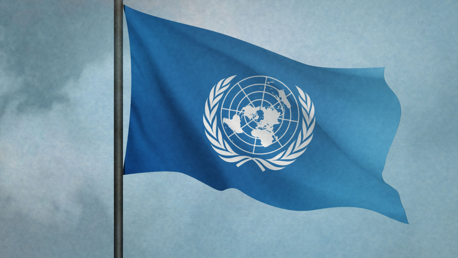 Illustration med Förenta nationernas blåvita flagga mot en en molnig himmel.